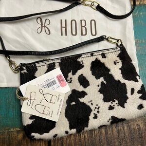 Brown and cream colored Hobo purse.